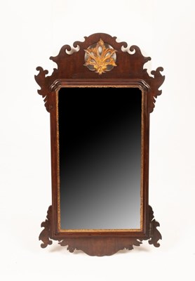 Lot 742 - A George II fret carved wall mirror with...