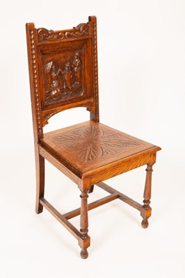 Lot 744 - A carved oak single chair, the back with a...