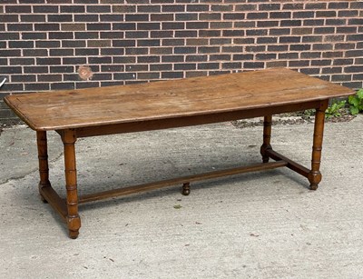 Lot 750 - A 20th Century refectory table on turned legs...