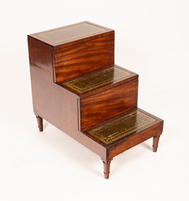 Lot 773 - A late George III mahogany bedside three step...