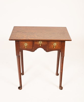 Lot 778 - A George II oak lowboy, the three drawers...