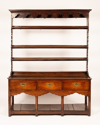 Lot 780 - A George III oak pot board dresser, probably...