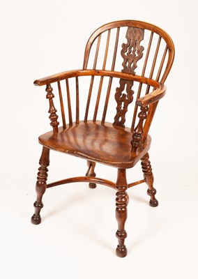 Lot 781 - A yew wood and elm Windsor chair, 19th Century,...