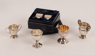 Lot 7 - Three miniature silver trophy cups, an egg cup...
