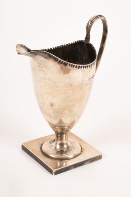 Lot 25 - A Victorian helmet-shaped silver cream jug,...