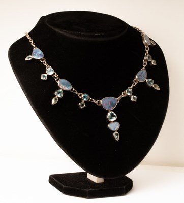 Lot 88 - An opal and blue topaz necklace set in silver...