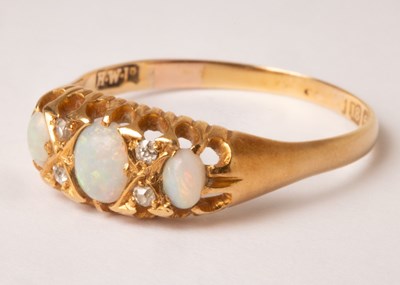 Lot 89 - An Edwardian opal and diamond ring, HWLd,...