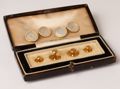 Lot 96 - A pair of mother-of-pearl cufflinks set in...