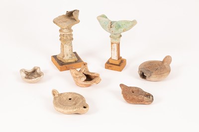 Lot 220 - Three Roman pottery oil lamps and four shaped...