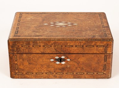 Lot 283 - A walnut inlaid box containing turned wooden...