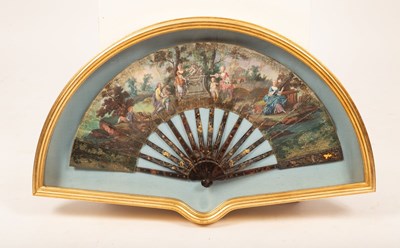 Lot 293 - A painted fan decorated a bucolic scene with...