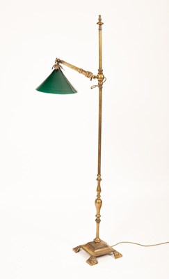 Lot 319 - A brass floor standing reading light, with...