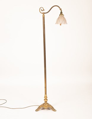 Lot 320 - A brass standard lamp with clear flared glass...