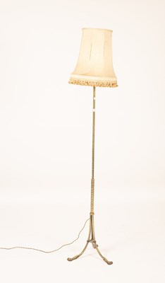 Lot 322 - An engraved brass standard lamp