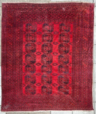 Lot 332 - An Afghan carpet, the sang du boeuf field of...