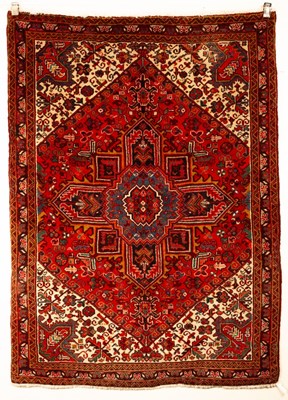 Lot 337 - A Heriz rug, North West Persia, the madder...