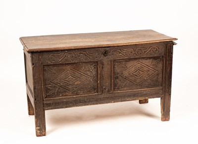 Lot 416 - A 17th Century oak coffer, with carved panel...