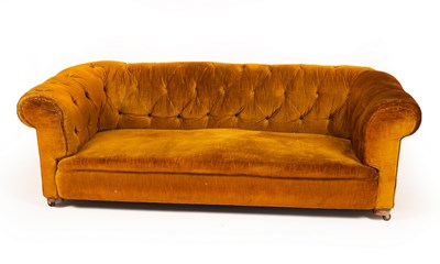 Lot 426 - A Chesterfield sofa upholstered in dark ochre...