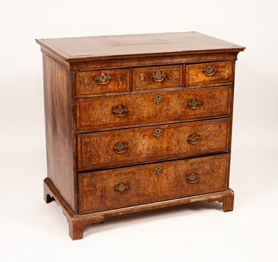 Lot 457 - An early 18th Century walnut chest of three...