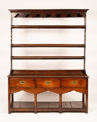 Lot 467 - A George III oak pot board dresser, probably...