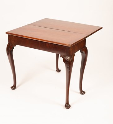 Lot 468 - A George II mahogany tea table, the fold-over...