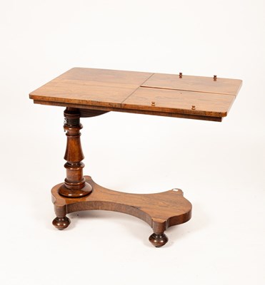 Lot 495 - A Victorian rosewood reading/music table, the...