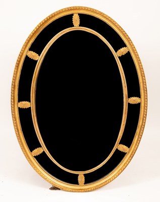 Lot 497 - A George III style oval mirror with gadrooned...