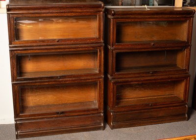 Lot 502 - Two Globe Wernicke oak bookcases each of three...