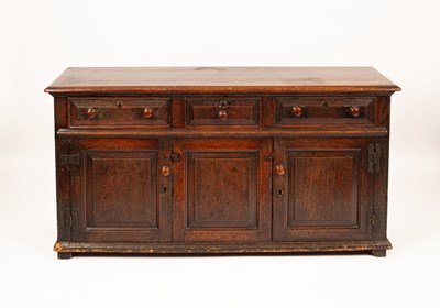 Lot 516 - An 18th Century oak dresser base, fitted three...