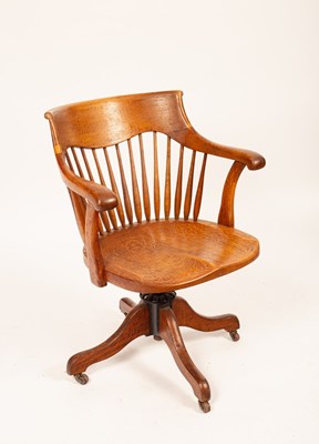 Lot 533 - An early 20th Century oak swivel desk chair,...