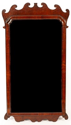 Lot 542 - A George II walnut framed fret carved mirror,...