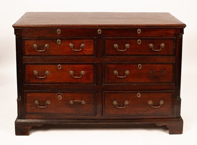 Lot 554 - An oak mule chest with hinged lid, four dummy...