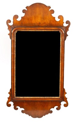 Lot 568 - A George II walnut fret carved mirror, 82cm long