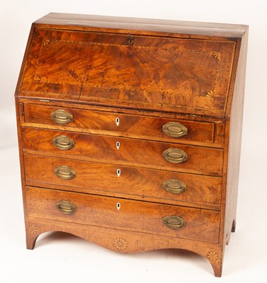 Lot 572 - A George III mahogany and inlaid bureau, fall...