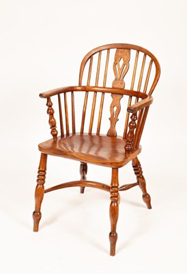 Lot 574 - An elm and ash Windsor armchair with crinoline...