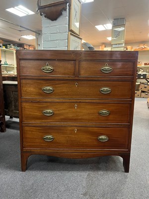 Lot 585 - A 19th Century mahogany chest of two short...