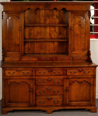 Lot 587 - A George III style oak dresser by Brights of...