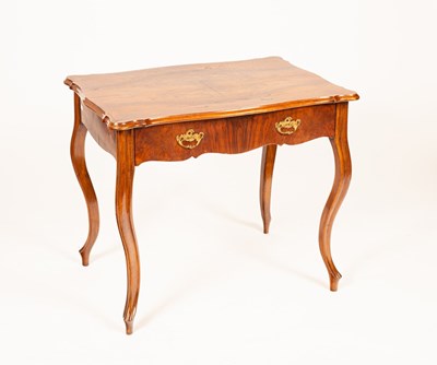 Lot 594 - A 20th Century walnut side table with frieze...