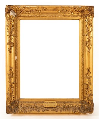 Lot 735 - A gilt plaster picture frame applied scrolls,...