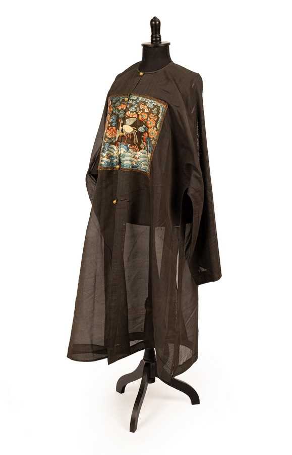 Lot 130 - A Chinese surcoat pufu, 19th Century, in black...