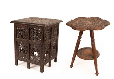 Lot 164 - A heavily carved Middle Eastern table of...