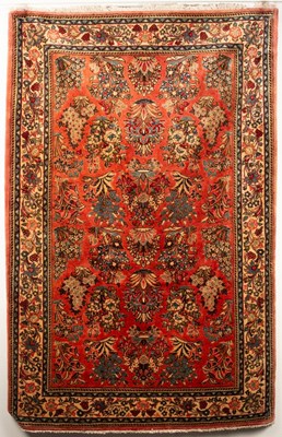 Lot 265 - A Sarouk rug, West Persia, the light cranberry...