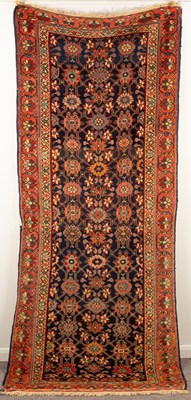 Lot 277 - A Kurdish long rug, the indigo field of Mina...