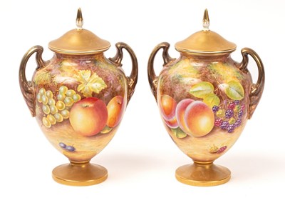 Lot 546 - A pair of Royal Worcester two-handled vases...