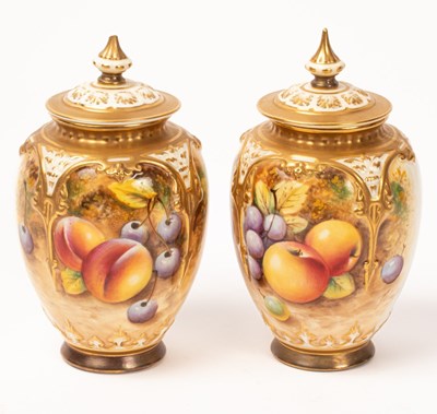 Lot 547 - A near pair of Royal Worcester pot-pourri...