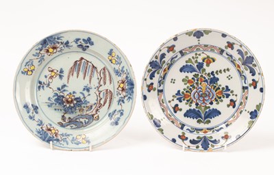 Lot 560 - An English polychrome Delftware plate, in blue,...