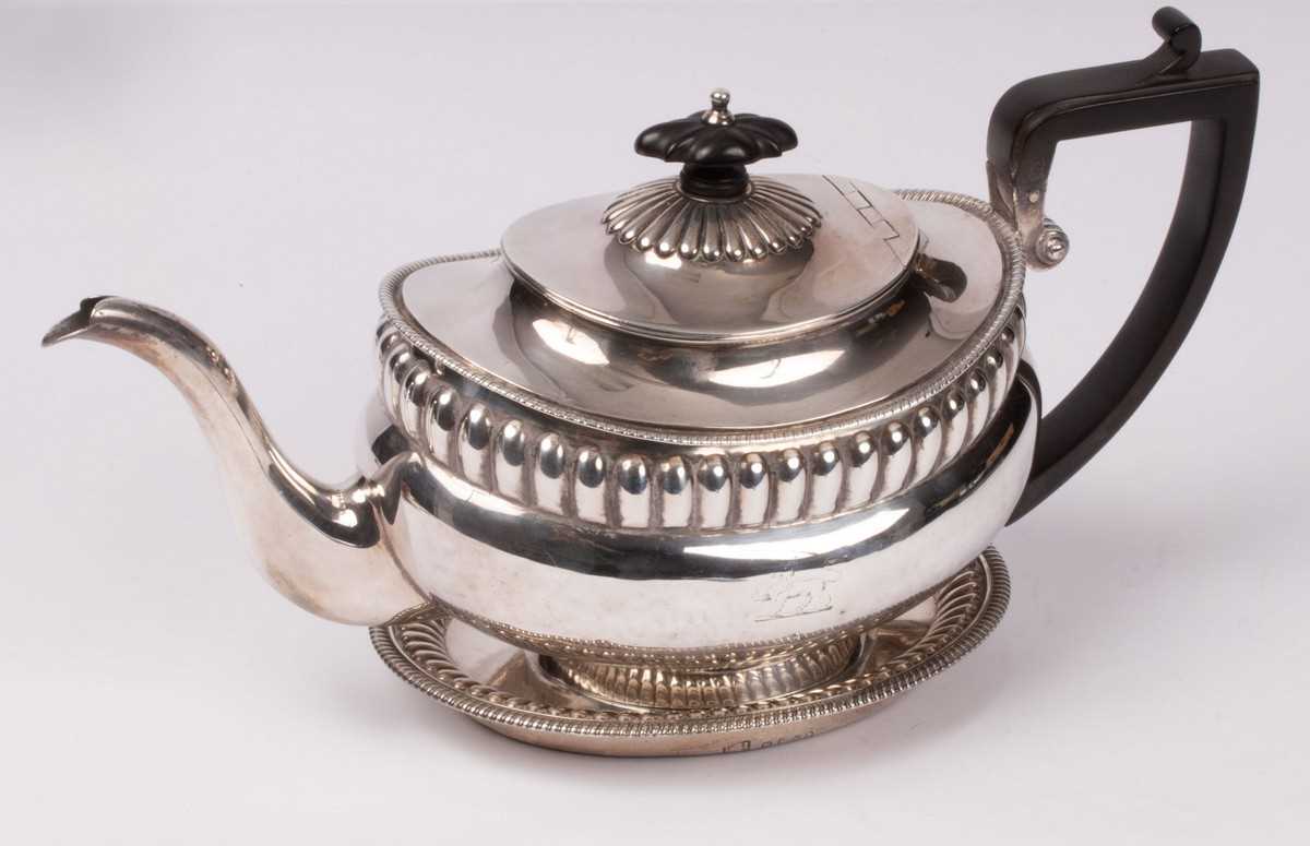 Lot 22 - A George III silver teapot and stand, Robert &...