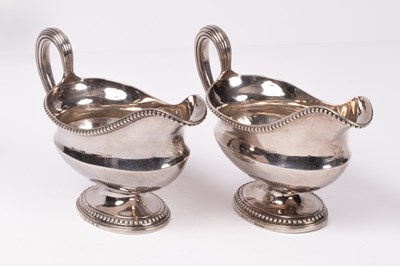 Lot 35 - A pair of George III silver sauce boats,...