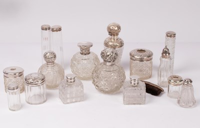 Lot 38 - A large quantity of silver mounted glass scent...