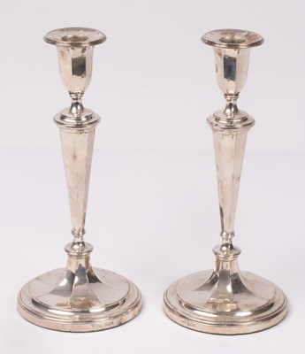 Lot 46 - A pair of Adam style silver candlesticks,...